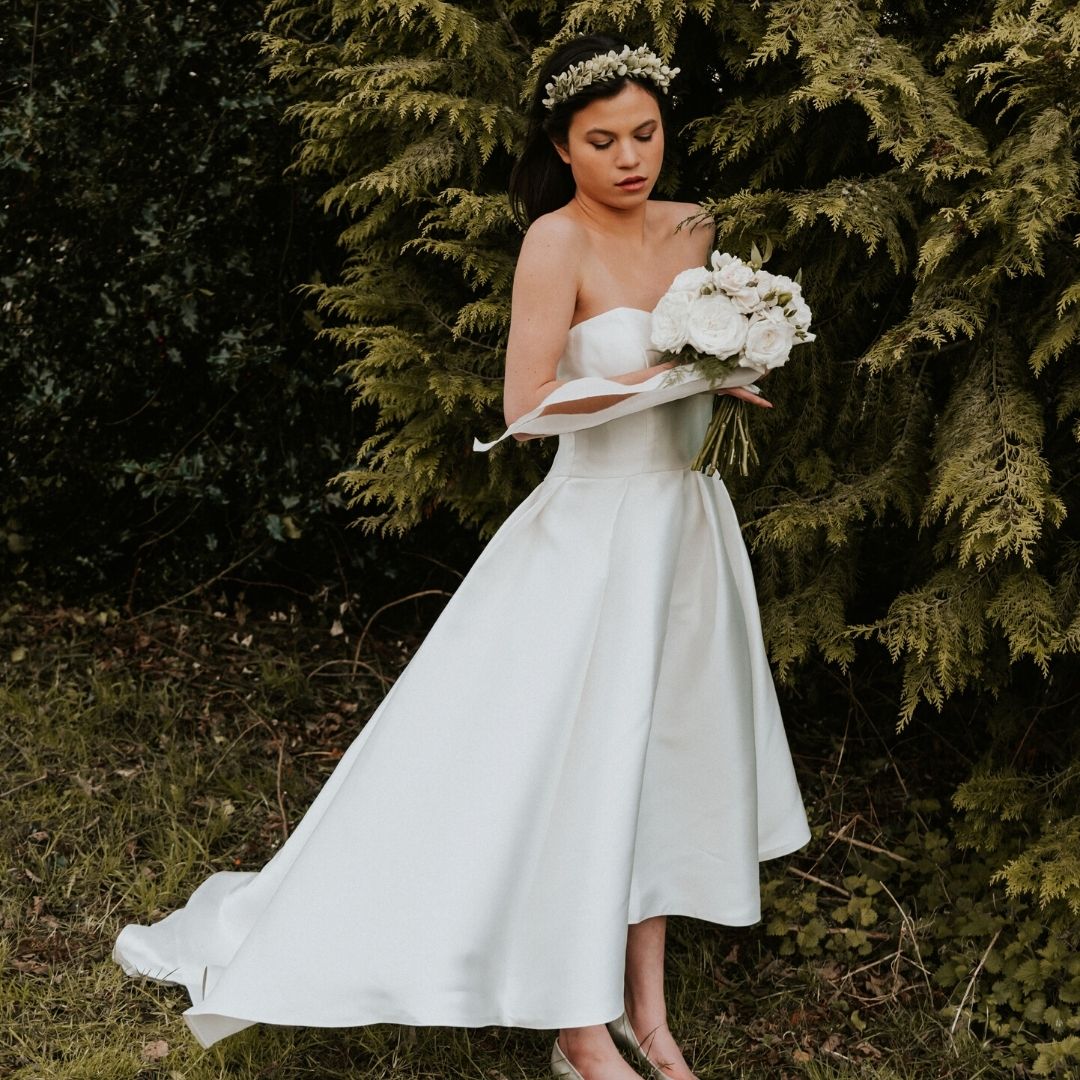 bride in ankle length wedding dress with bouquet