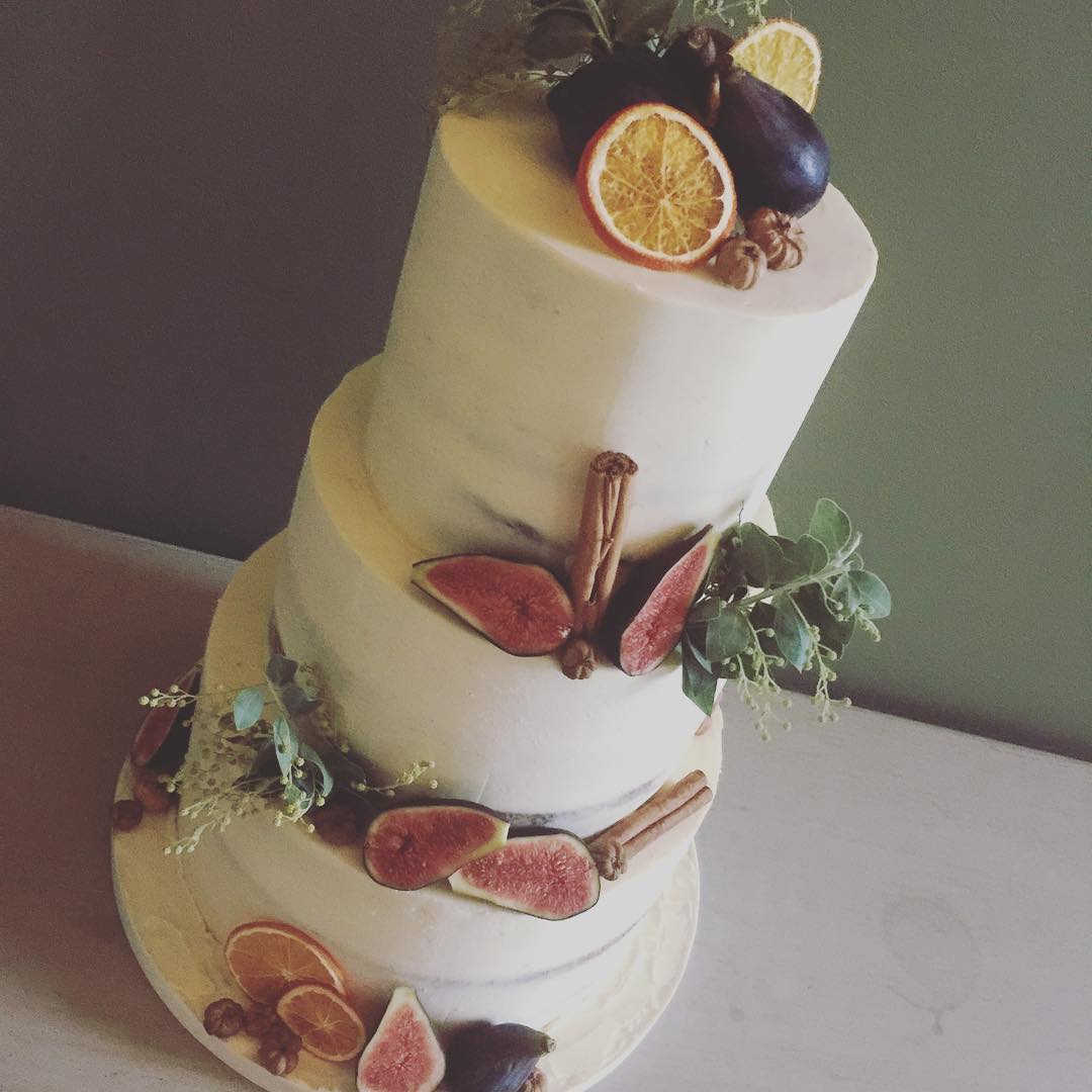 Semi naked wedding cake with fresh fruit