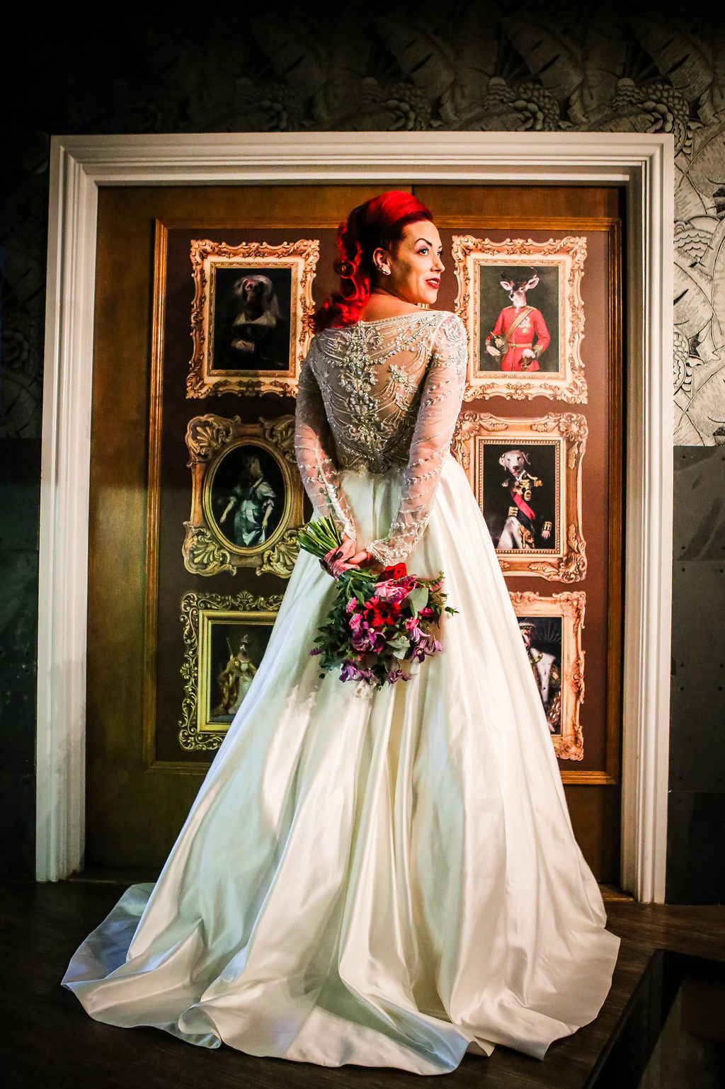 Crystal back wedding dress and bridal bouquet