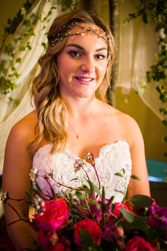 Bride with hair vine and pink bouquet