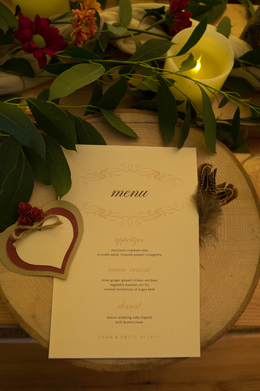 Menu laid out on wooden table setting