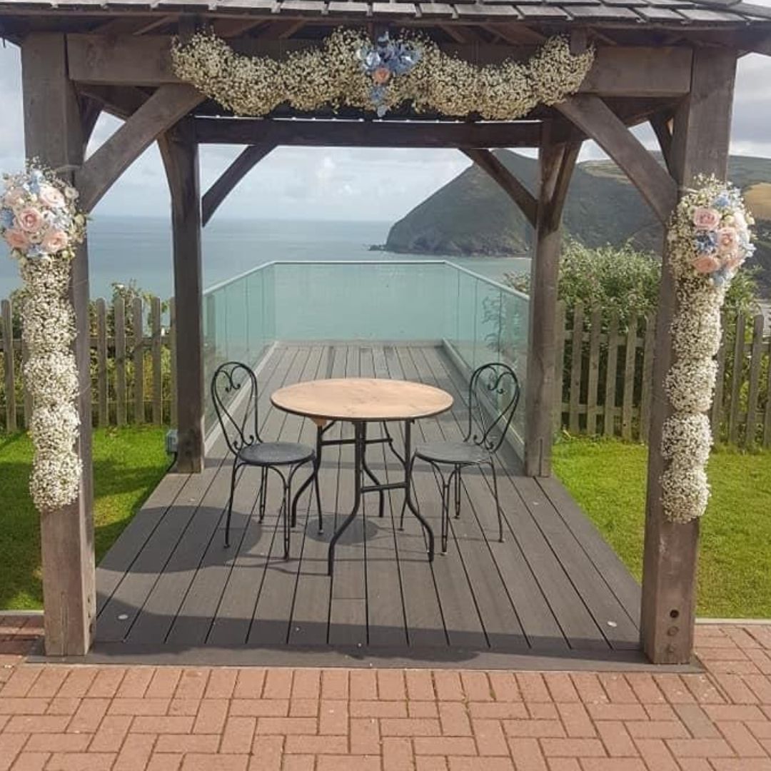 Floral display on wedding arch at Sandy Cove