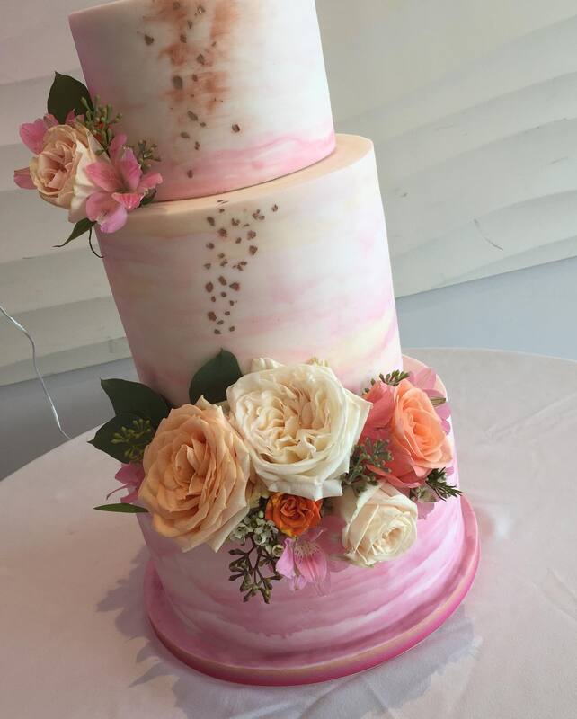 Pink marble wedding cake with Fresh flowers