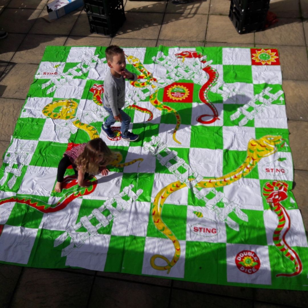 Children playing sankes & ladders during Gillys creche