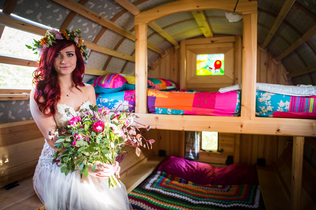 Bride inside of gypsy caravan