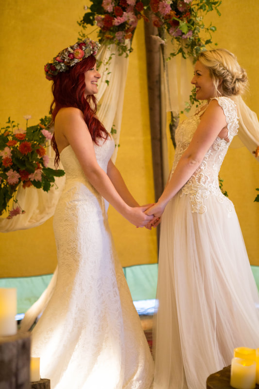 Two brides in wedding dresses