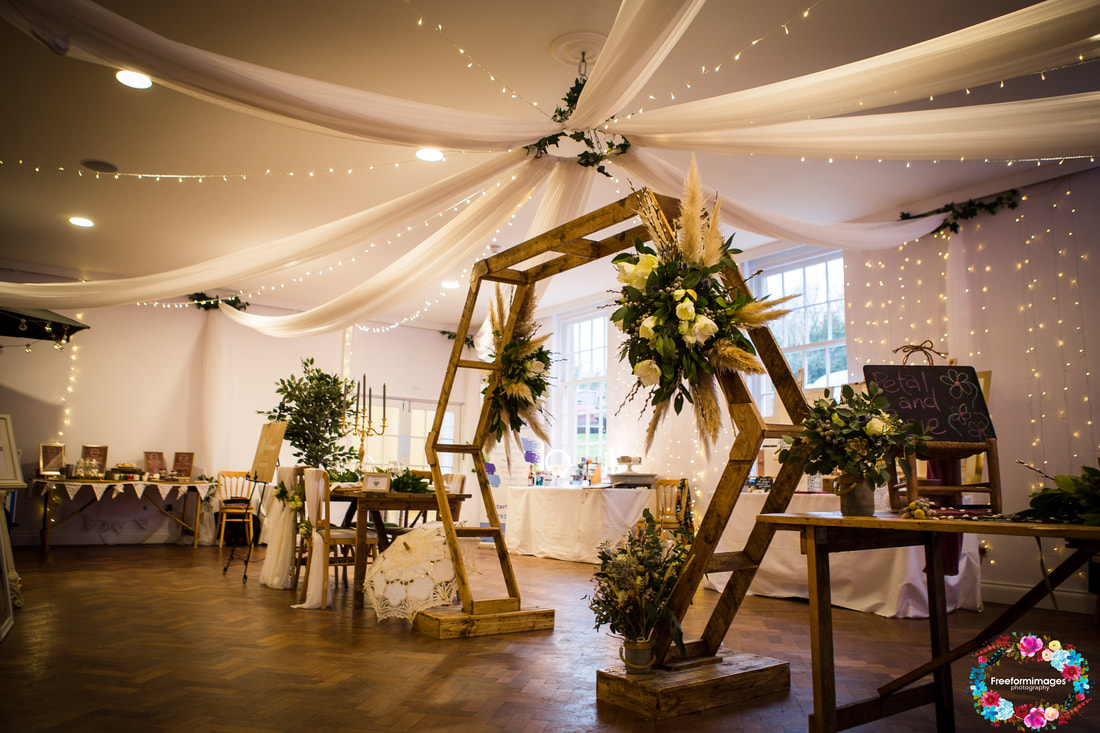 Tawstock Court wedding setup with hexagon arch
