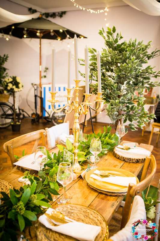 Wedding table setup with gold candelabra, cutlery and charger plates by do me a favour 